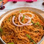 Smoky tandoori Chinese noodles served in a bowl with spring onion garnish